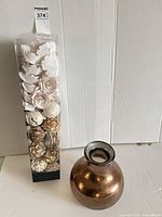 Vase beside unopened boxed fillers