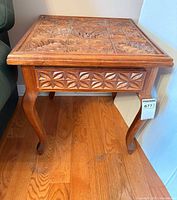Full view of carved wooden end table