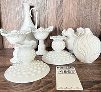 Group of milk glass pieces displayed together