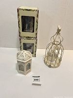 Two boxed mini lamps, cream birdcage tealight holder, white hexagonal lantern tealight holder