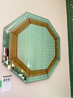Full view of octagonal mirror on wall