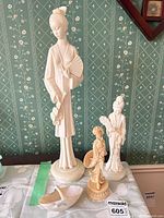 Front view of all three figurines on tabletop