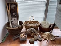 Group shot of baskets, shells, pictures, buckets