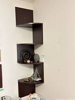 Full view of corner shelf with all decor items displayed