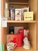 Wide shot of shelf holding all boxed and loose items listed