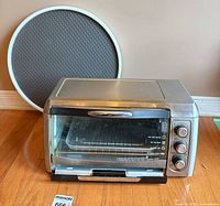 Toaster oven and round baking pan front view