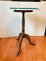 Full view of tripod accent table showing marble top and wood base
