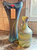 Tall marbled art glass vase and matching bottle with stopper removed