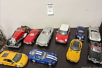 Top view of all ten diecast cars on shelf
