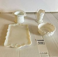 Group shot of all four porcelain pieces