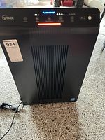 Full front view of Winix air purifier with cord visible