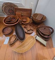 Group shot showing all wooden serveware pieces on floor