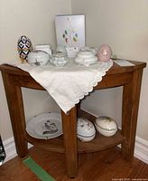 Corner table with assorted porcelain boxes, plate, boxed egg tree kit