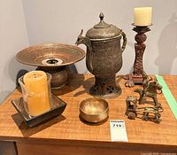 Group view of all brass decor items on tabletop