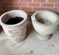 Two planters side by side showing overall forms and relative sizes