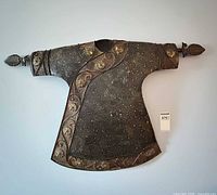 Full view of metal robe wall sculpture on wall