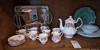 Complete lot showing tea set, serving tray and additional plates