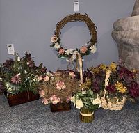 Group shot of wreath and all four floral arrangements