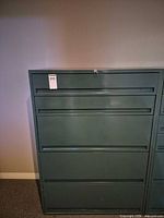 front view showing five drawers and lock