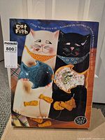 Front of sealed box showing Cat Fish chip & dip platter design