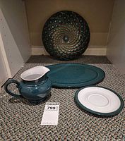 All four items: pitcher, oval platter, dinner plate, spiral decor plate