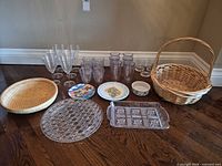 All items laid out: platters, plates, glasses, baskets