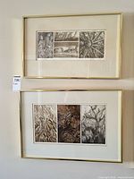 Two framed etchings hung vertically