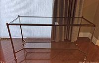 Full view of rectangular glass and metal console table