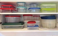 Cupboard shelf showing entire assortment of containers