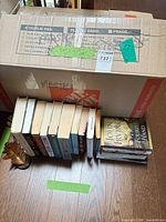 Overall view of box, row of books and bookends