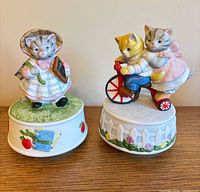 Both porcelain kitten music boxes front view