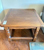 Full view of wooden side table front angle