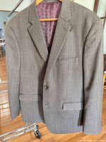 Front view brown herringbone blazer on hanger