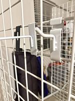 Hooks and clip mounted on gridwall to show fit and finish