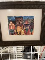 Framed print full view within bronze-tone frame and mat