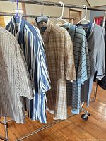 Front view of all five shirts on garment rack