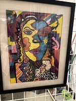 Front view of framed abstract multicolor print