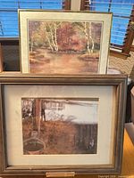 Both framed prints together showing size contrast and frame styles