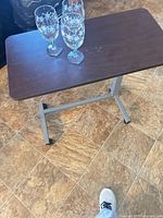 Three snowflake wine glasses on small table, full view