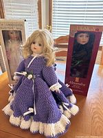 All three dolls, boxed Connoisseur Collection doll left, unboxed purple-dress doll center, boxed PS Alexandra doll right