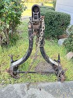 Front view of A-frame tow bar with chains and hitch coupler