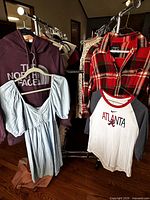 All four garments hanging on rack