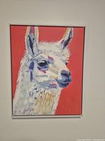 Front view of framed llama canvas art