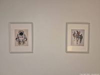 Both framed prints on wall, showing subjects and matching frames