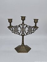 Front view showing three arms and openwork double happiness motif