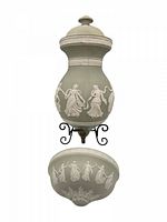 Full view of assembled lavabo showing lid, reservoir, basin, bracket, and spigot