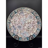 Front view showing full floral enamel design and border