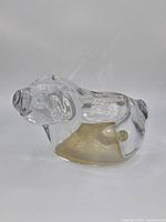 Left profile of crystal piggy bank showing clarity and Gordon Scott sticker