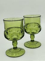Two green Kings Crown goblets angled view