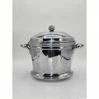 Front view of silver Keystone Ware ice bucket with lid and knob